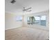 Sunlit bedroom with a view of the water and a private dock at 1907 4Th W St, Palmetto, FL 34221