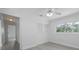 Bedroom offers closet space and is brightly lit by large window at 1907 4Th W St, Palmetto, FL 34221