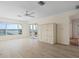 Spacious bedroom with light wood flooring and views of the outside deck at 1907 4Th W St, Palmetto, FL 34221