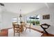 Bright dining room with water views from large windows, and a stylish modern round table at 1907 4Th W St, Palmetto, FL 34221