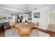 Bright dining area near kitchen with modern table, white walls, and earth tone tile flooring at 1907 4Th W St, Palmetto, FL 34221