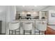 Kitchen area with a white breakfast bar and white cabinets at 1907 4Th W St, Palmetto, FL 34221
