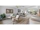 Open concept living room with contemporary decor, light wood floors, and stylish furnishings at 1907 4Th W St, Palmetto, FL 34221