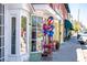 Charming storefront adorned with patriotic balloons and outdoor seating, offering a welcoming neighborhood ambiance at 1907 4Th W St, Palmetto, FL 34221