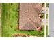 Aerial view of a beautiful townhome featuring manicured landscaping and a colorful roof at 20398 Lagente Cir, Venice, FL 34293