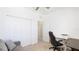 Bedroom with home office space, including a desk and a sofa at 20398 Lagente Cir, Venice, FL 34293
