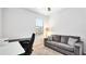 Home office area with sofa, desk, and ceiling fan at 20398 Lagente Cir, Venice, FL 34293