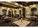 Comfortable dining area featuring tables and seating below decorative hanging lights at 20398 Lagente Cir, Venice, FL 34293