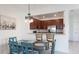 Dining area with stainless steel appliances and eat in bar top at 20398 Lagente Cir, Venice, FL 34293
