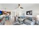 Bright and spacious living room featuring tile flooring and a cozy seating area at 20398 Lagente Cir, Venice, FL 34293