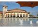 Beautiful pool area with lounge chairs and umbrellas offering a relaxing atmosphere by the water at 20398 Lagente Cir, Venice, FL 34293