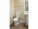 Bathroom featuring neutral paint color, tile flooring, sink and toilet at 215 63Rd E Dr, Bradenton, FL 34203