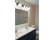 Bright bathroom with a dual sink vanity and updated fixtures at 215 63Rd E Dr, Bradenton, FL 34203