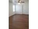 Spacious bedroom with wood-look flooring and a ceiling fan for added comfort at 215 63Rd E Dr, Bradenton, FL 34203