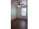 Cozy bedroom featuring wood-look flooring and a window for natural light at 215 63Rd E Dr, Bradenton, FL 34203