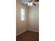 Cozy bedroom featuring a ceiling fan and a bright window with pleasant natural light at 215 63Rd E Dr, Bradenton, FL 34203