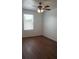 Bright bedroom with wood-look flooring and a ceiling fan at 215 63Rd E Dr, Bradenton, FL 34203