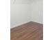 A simple closet space with a shelf and wood-look flooring at 215 63Rd E Dr, Bradenton, FL 34203