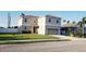 Charming two-story home with a well-manicured lawn and an attached two-car garage at 215 63Rd E Dr, Bradenton, FL 34203