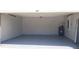 Open garage with painted floor and white walls ready for your vehicles and storage at 215 63Rd E Dr, Bradenton, FL 34203