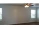 This is a spacious living room with a ceiling fan and nice natural light at 215 63Rd E Dr, Bradenton, FL 34203