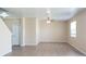 Spacious living area boasting tile floors and a ceiling fan for added comfort at 215 63Rd E Dr, Bradenton, FL 34203