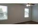 This is a spacious living room with a ceiling fan and nice natural light at 215 63Rd E Dr, Bradenton, FL 34203