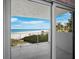 Beautiful ocean view from the balcony with white railings and tile flooring at 2301 Gulf Of Mexico Dr # 36N, Longboat Key, FL 34228