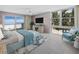 Serene bedroom with balcony access, offering ocean views, and a comfortable seating area at 2301 Gulf Of Mexico Dr # 36N, Longboat Key, FL 34228