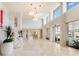 Spacious lobby with high ceilings, elegant lighting, marble floors, and inviting seating areas at 2301 Gulf Of Mexico Dr # 36N, Longboat Key, FL 34228