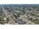 Aerial view of a neighborhood featuring tree-lined streets and a home with a private pool at 2609 Webber St, Sarasota, FL 34239