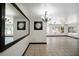 Bright living room with large mirror, tile floors and a view to the backyard at 2609 Webber St, Sarasota, FL 34239