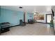 Bright and airy living room with tile floors and a view to the backyard at 2609 Webber St, Sarasota, FL 34239