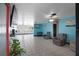 Spacious living room with blue accent wall, tile floors and views to the backyard at 2609 Webber St, Sarasota, FL 34239