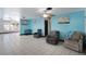 Comfortable living area with blue walls, tile flooring and cozy seating at 2609 Webber St, Sarasota, FL 34239