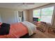 Bedroom with ceiling fan, closet and console table with window views at 2906 Arlington St, Sarasota, FL 34239