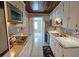 Efficient kitchen featuring tile floors, bright cabinets, and modern appliances at 2906 Arlington St, Sarasota, FL 34239