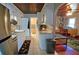 Well-lit kitchen featuring tile floors, bright cabinets, and an adjacent doorway at 2906 Arlington St, Sarasota, FL 34239