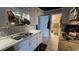Efficient kitchen with granite countertops, white cabinets, and stainless sink at 2906 Arlington St, Sarasota, FL 34239