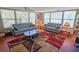 Comfortable living room with lots of light, couches and colorful rug at 2906 Arlington St, Sarasota, FL 34239