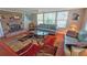 Bright living room with a brick fireplace, plush sofas, and window at 2906 Arlington St, Sarasota, FL 34239