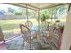 Screened in porch area featuring a dining table and outdoor seating at 2906 Arlington St, Sarasota, FL 34239