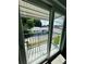 Balcony view through sliding glass doors, featuring metal railing and outdoor view at 3101 Bee Ridge Rd # 221, Sarasota, FL 34239