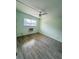 Well-lit bedroom featuring updated wood-look flooring and a ceiling fan at 3101 Bee Ridge Rd # 221, Sarasota, FL 34239