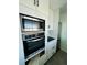 Modern kitchen showcasing stainless steel appliances and stylish white cabinetry at 3101 Bee Ridge Rd # 221, Sarasota, FL 34239