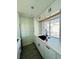 Modern kitchen sink and counter area featuring white cabinets and a bright window view at 3101 Bee Ridge Rd # 221, Sarasota, FL 34239