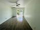 Spacious living room featuring tile floors, ceiling fan, and sliding doors to the balcony at 3101 Bee Ridge Rd # 221, Sarasota, FL 34239