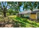 Expansive backyard with mature trees and plenty of space for recreation at 314 Pembroke Ln # 189, Venice, FL 34293