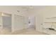 Bedroom featuring carpet flooring and doorways, as well as access to built in shelving unit and window at 314 Pembroke Ln # 189, Venice, FL 34293