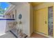 Inviting front entry featuring tile flooring and a bright yellow front door at 314 Pembroke Ln # 189, Venice, FL 34293